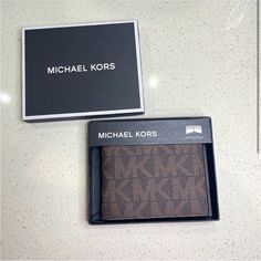 Michael Kors Mens Wallet Brown Logo Slim Billfold Father’s Day Gift Men’s Gift Birthday Gift Brown Rectangular Wallet With Logo, Michael Kors Luxury Bifold Wallet, Michael Kors Rfid Blocking Rectangular Wallet, Michael Kors Wallets With Card Slots For Gift, Michael Kors Rfid-blocking Rectangular Wallet, Michael Kors Rfid-blocking Wallet, Modern Michael Kors Rectangular Wallets, Leather Bifold Wallet With Logo, Classic Michael Kors Leather Wallet