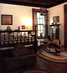 an old fashioned bedroom with antique furniture and decor