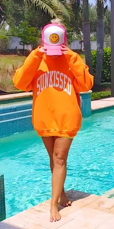 Get ready to embrace the summer vibes with our sunkissed sweatshirt! This versatile piece can be worn all year round, whether you're at the beach or by the pool. Its preppy and trendy design will add a pop of color and brightness to your wardrobe. Stay casual and comfortable while radiating sunshine wherever you go.

SmileSoulThreads.com Beach Preppy, Casual Summer Outfit