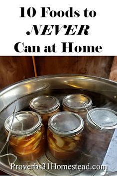 jars filled with pickles sitting on top of a metal pan next to a sign that says 10 foods to never can at home