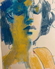 a drawing of a woman's face with blue, yellow and green colors on it