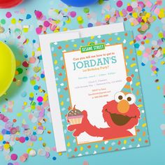 a sesame street birthday party with confetti and balloons