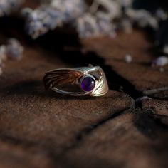 Illyrian Inspired Wings Ring is a reminder of magical tales, this classic ring has been carefully crafted for timeless beauty. Representing the beauty and grace of Illyrian wings, it’s an elegant piece sure to bring a touch of enchantment to any outfit fans of the ACOTAR series or not! Handmade in Sterling silver, brass. Sterling silver ring brass wings 6mm Amethyst inspired by Rhys's eyes 6mm Ruby inspired by Cassian's Siphons 6mm Sapphire inspired by Azriel's Siphons MADE TO ORDER. Available to ship in 5-7 business days. Mystical Gemstone Rings For Formal Occasions, Mystical Yellow Gold Ring, Mystical Yellow Gold Ring Jewelry, Mystical Yellow Gold Wedding Ring, Spiritual Open Ring Jewelry For Formal Occasions, Mystical Yellow Gold Jewelry For Anniversary, Mystical Gemstone Jewelry For Formal Occasions, Elegant Winged Rings As Gifts, Elegant Winged Rings For Gifts