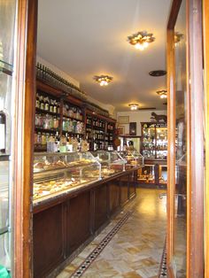 a store filled with lots of different types of food and drink on top of shelves