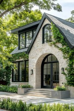 a house that is surrounded by trees and bushes