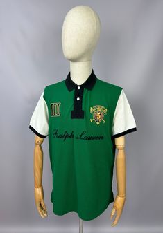 Vintage Polo Ralph Lauren Snow Polo Challenge Polo Shirt Size XL Custom Fit 90s Excellent used condition, without any rips/stains/ etc. PLEASE CHECK MEASUREMENTS!! pit2 pit: 23'6" inches \ 60 cm length on the back: 30'7" inches \ 78 cm shoulders: 19'2" inches \ 49 cm If u have any questions please contact me before purchase Green Short Sleeve Polo Shirt For Streetwear, Vintage Green Collared T-shirt, Green Cotton Polo Shirt For Streetwear, Green Collared T-shirt For Streetwear, Green Polo Collar Top For Streetwear, Casual Green Polo Shirt For Streetwear, Retro Green Short Sleeve Polo Shirt, Green Polo Shirt With Graphic Print, Green Graphic Print Polo Collar Top