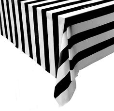 a black and white striped table cloth on a dining room table