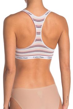 Calvin Klein Medium Support Sports Bra For Workout, Trendy Racerback Sports Bra With Medium Support, Trendy Medium Support Racerback Sports Bra, Spring Stretch Calvin Klein Bra, Calvin Klein Stretch Seamless Sports Bra, Calvin Klein Fitted Sports Bra For Athleisure, Calvin Klein Fitted Athleisure Sports Bra, Calvin Klein Seamless Spring Bra, Calvin Klein Seamless Sports Bra With Medium Support