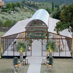 an outdoor wedding venue set up in the middle of a field with chairs and tables