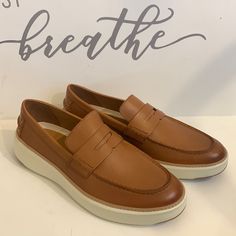 Cole Haan Men's British Tan Grandpro Topspin Penny Loafers Size 12. Never Worn Without Box. Condition Is As Shown In Pictures. Casual Wingtip Loafers With Contrast Sole, Classic Brown Low-top Loafers, Low-top Moccasins With Leather Sole For Business Casual, Business Casual Low-top Moccasins With Leather Sole, Casual Slip-ons With Brogue Detailing And Moc Toe, Low-top Loafers With Rubber Sole For Business Casual, Modern Brown Low-top Loafers, Business Casual Low-top Loafers With Rubber Sole, Brown Modern Low-top Loafers