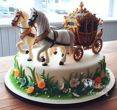 there is a cake that looks like a horse drawn carriage