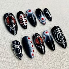 Embrace your dark side with our Custom Red Eyes Press On Nails. These gothic punk rock skeleton nails are the perfect accessory for any goth Y2K look. The dark black base adds a mysterious touch, while the red eyes add a pop of color that will turn heads. Make a bold statement with these edgy and trendy press on nails. #y2knails Skeleton Nails, Black Fake Nails, Rock Skeleton, Nails Gothic, Nails Goth, Long Almond, Punk Nails