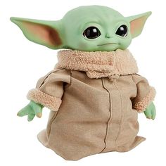 the child yoda doll is wearing a brown outfit