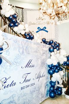 blue and white balloons are on display at a bridal event