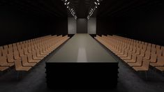 an empty room with rows of chairs and lights on either side of the room,