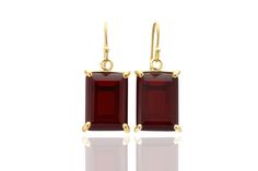 Make a statement with these gorgeous Rectangular Garnet Gold Dangle Earrings. Measuring 13x18mm, these earrings feature prong-set semiprecious garnet stones, making them a perfect accessory to celebrate your January birthstone. The gold finish adds a touch of luxury, making these earrings a great choice for special occasions. These handmade earrings are crafted with high-quality materials and are sure to last for years to come. January birthstone garnet earrings Prong set semiprecious stones Han Sterling Silver Earrings Handmade, Garnet And Gold, Rectangle Earrings, Gold Dangle Earrings, Fancy Gifts, January Birthstone, Garnet Earrings, Garnet Stone, Red Earrings