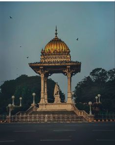 an ornate building with a golden dome on top