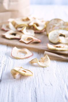 sliced apples on a wooden cutting board