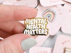 item: "mental health matters" pin why you'll love it:you've said it once and you'll say it again: mental health matters. Show off your support for mental health care with this gold enamel pin. if you could see it IRL: 1" gold enamel pin with white text. Single-post backing. All products sold by KynYouBelieveIt are designed, made, and packaged with love in San Marcos, Texas. Every order that goes out the door receives several special touches, including (but not limited to!) cute packaging and a p Gift For Therapist, San Marcos Texas, Custom Lapel Pins, Pin Cute, Pin Design, Therapist Gifts, Mental Health Care