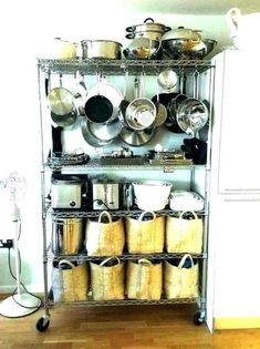 a rack with pots and pans on it