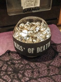 a metal bowl filled with lots of candy