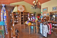 a room filled with lots of different items on tables and shelves next to each other