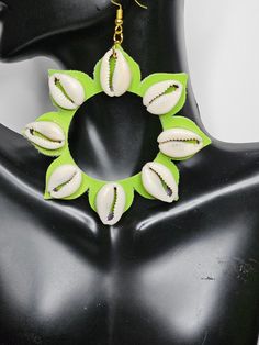 Approx 3"  Material: Faux Leather,  Cowrie shells nickel free findings These do have some weight due to the shells,  but do not pull on the ears or cause sagging  ** Please note that all monitors show colors in slightly different variations Green Flower-shaped Earrings For Beach, Green Flower-shaped Beach Earrings, Cowrie Shells, Sunflower Earrings, African Beads, Cowrie Shell, Creative Jewelry, Philadelphia Pa, Handmade Accessories