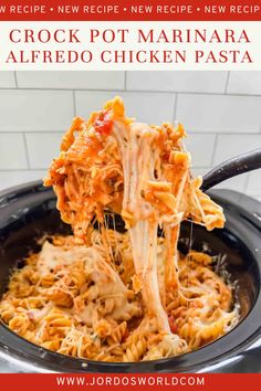 the crock pot marinara alfredo chicken pasta is being lifted from the slow cooker