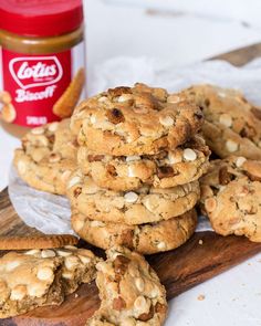 cookies and peanut butter on a wooden cutting board