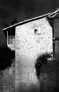 a black and white photo of a building with a cat looking out the window