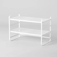 a white shelf sitting on top of a table