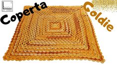 a yellow crocheted rug with the words copreta goldie on it