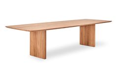 a long wooden table sitting on top of a white floor