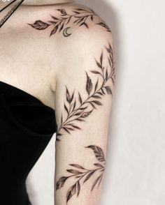 a woman with a tattoo on her arm