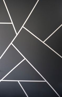 a black and white wall with lines painted on it