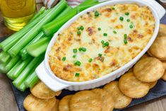 a casserole dish with green onions and crackers