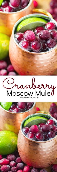 cranberry moscow mules with lime and cherries in copper cups on a table