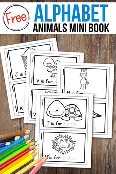 three printable alphabet mini book pages with pencils and crayons on the table