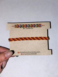 a hand holding a business card with an arrow on it