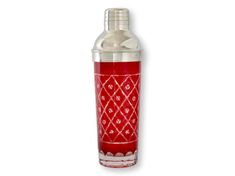 a red glass bottle with an ornate design on it