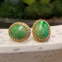 Beautiful apple green jade stud earrings set in decorative setting, Mid-Century in a Victorian revival style.  Total Earring Measurements: 14.8x12.1mm Metal: 14ky Backing: Push back Time Period: Approx 1960s- 1970s Classic Green Clip-on Earrings For Formal Occasions, Elegant Green Oval Clip-on Earrings, Vintage Jade Round Earrings, Vintage Turquoise And Sterling Large Oval Stud Earrings, Luxury Jade Cabochon Earrings, Green Nickel-free Jade Earrings, Luxury Green Vintage Clip-on Earrings, Victorian Revival, Time Period