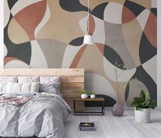 a bedroom with an abstract wallpaper and bed