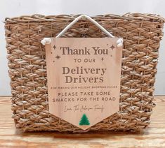 a wooden sign that says, thank you to our delivery drivers please take some snacks for the road