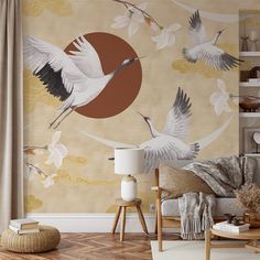 a living room filled with furniture and wallpaper covered in bird paintings on the walls