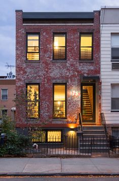 two story brick building with stairs leading up to it