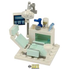 a lego dentist's office set is shown in white and has blue accessories on it