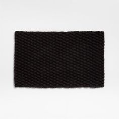 black knitted placemat on white background