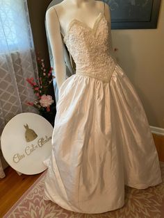 a mannequin wearing a wedding dress on display