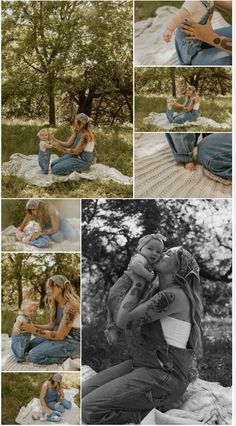 a woman holding a baby while sitting on top of a blanket in front of trees