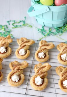 some cookies are on a cooling rack with eggs in the background